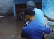 “Banjir Depok Heboh: Damkar Selamatkan Warga dan Kucing Oren dalam Evakuasi Berisiko”